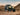 Can-Am Commander 1000 UTV, equipped with Perfex LED light, completing its desert ride against the backdrop of a sunset.