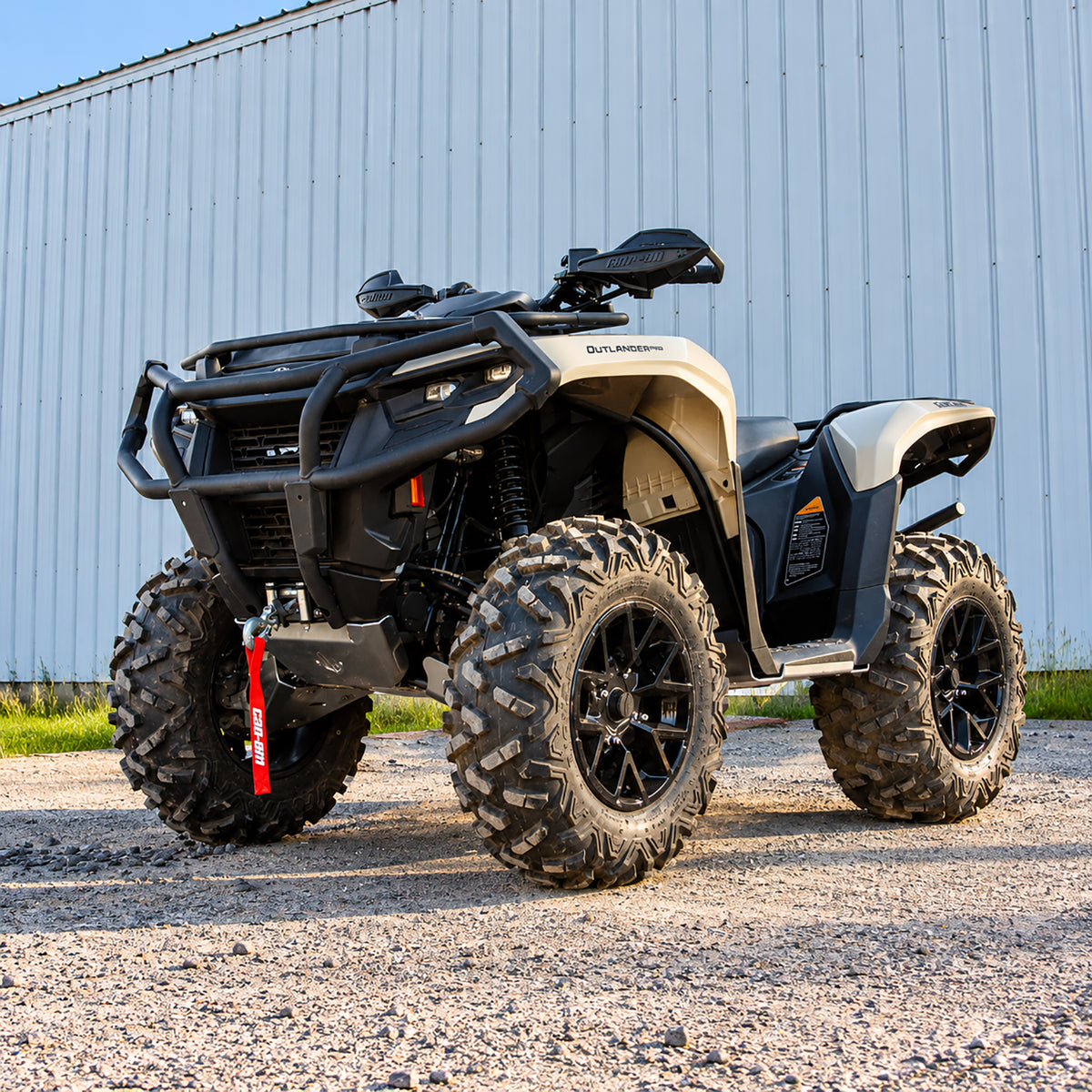 Front three-quarter view of a Can-Am Outlander 700 PRO equipped with a PERFEX 1-inch lift kit and skid plate.
