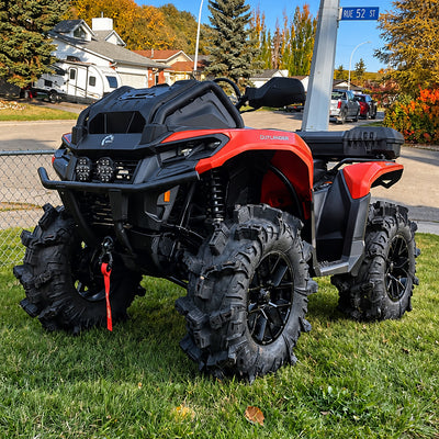 Can-Am Outlander X MR 700 with PERFEX 1-inch lift kit installed, featuring mud tires and increased ground clearance.