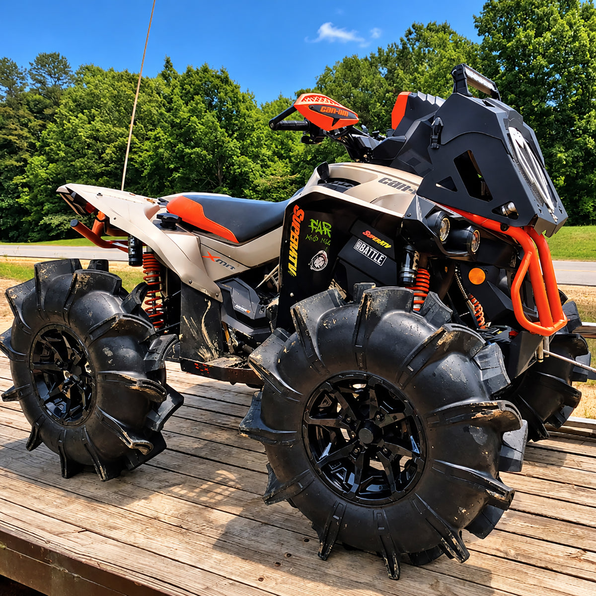 Front angle view of a Can-Am Renegade X MR 650 ATV with PERFEX 2" lift kit, oversized mud tires and raised off-road stance.