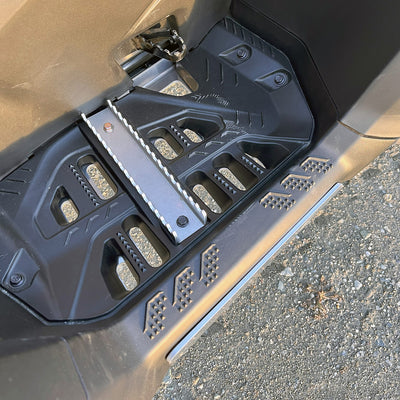 Close-up of PERFEX right aluminum foot peg mounted on a Can-Am Outlander MAX G3 1000R DPS ATV, showcasing robust 1/8-inch aluminum construction.