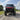 Front angle shot of lifted red CFMoto UForce U10 XL Pro Highland with 2.5-inch PERFEX lift kit and System3 RC500 tires — off-road ready with PERFEX mounting brackets installed