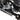 White background image of a Can-Am Outlander PRO, focusing on the PERFEX Industries rear A-arm guards protecting the suspension components of the ATV. Ideal for off-road adventures.