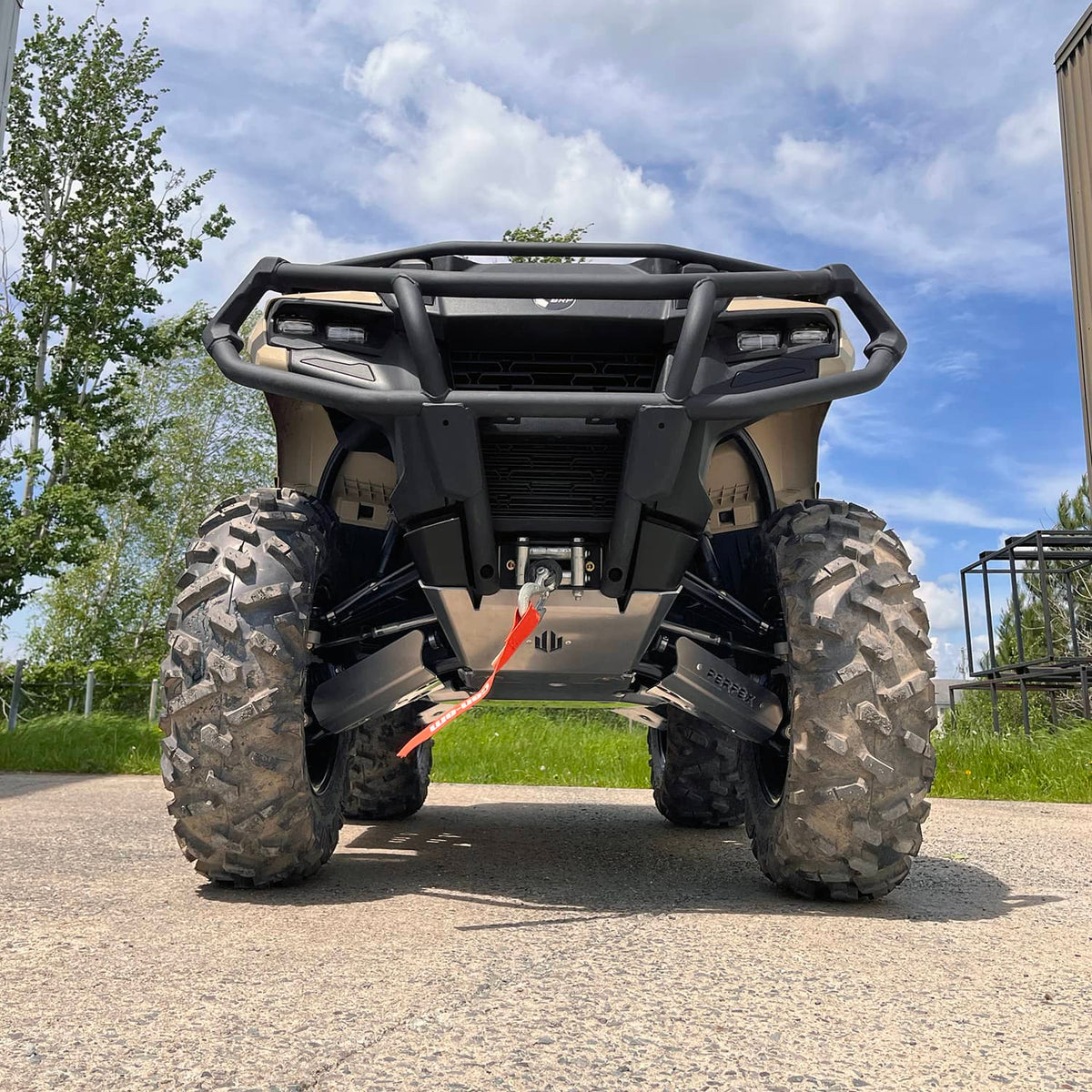 Front view of a 2024 Can-Am Outlander 700 equipped with PERFEX Industries' aluminum complete protection kit. This ATV is built to last for off-road adventures.