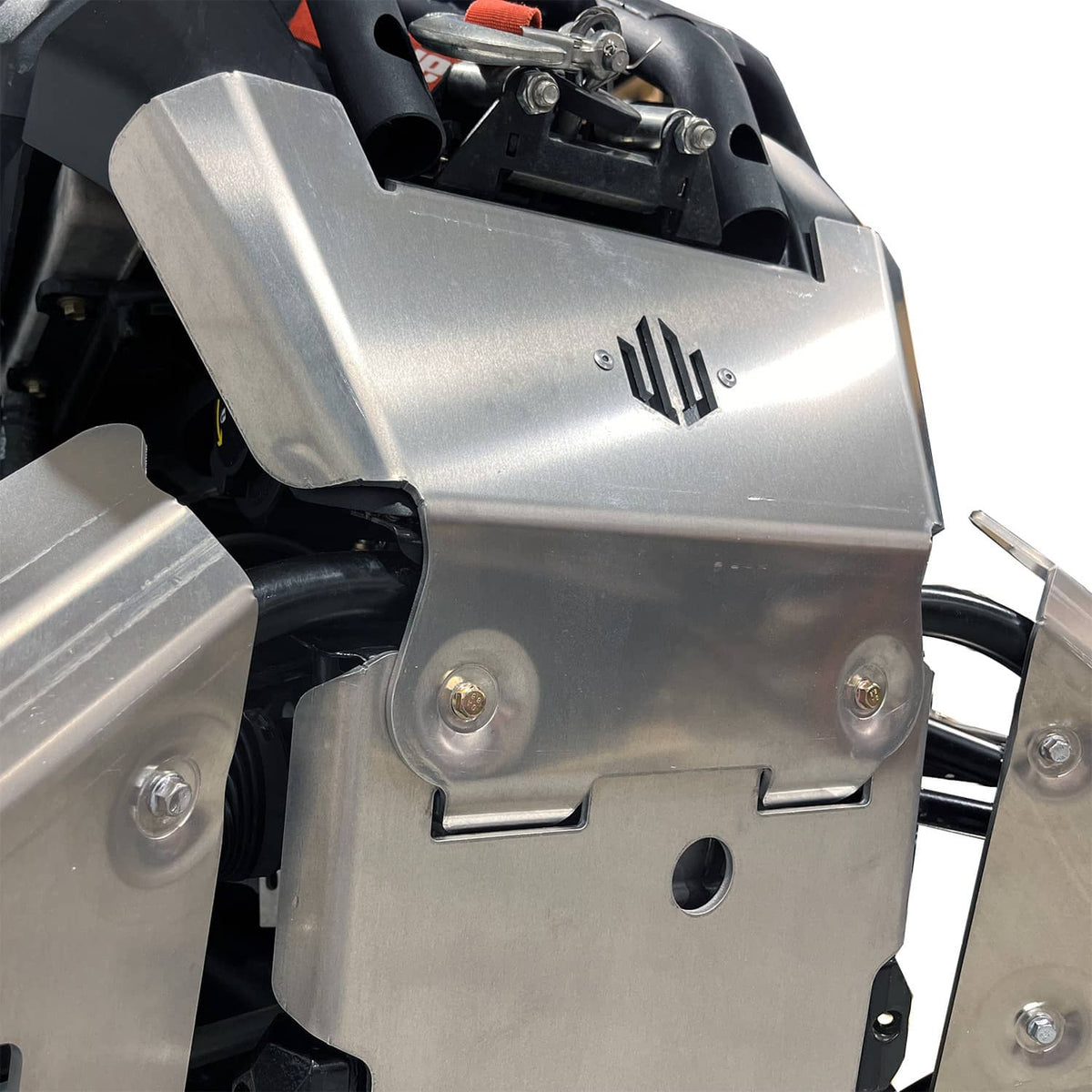 White background image of a Can-Am Outlander PRO, focusing on the PERFEX Industries bash plate for superior ATV protection. Ideal for off-road adventures.