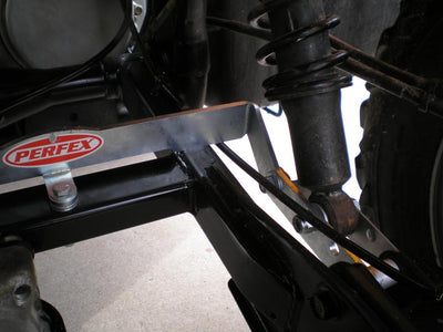 Detailed view of the bolt-on installation process for the PERFEX long travel suspension kit on a Honda Rubicon 500, highlighting the ease of setup with included hardware.