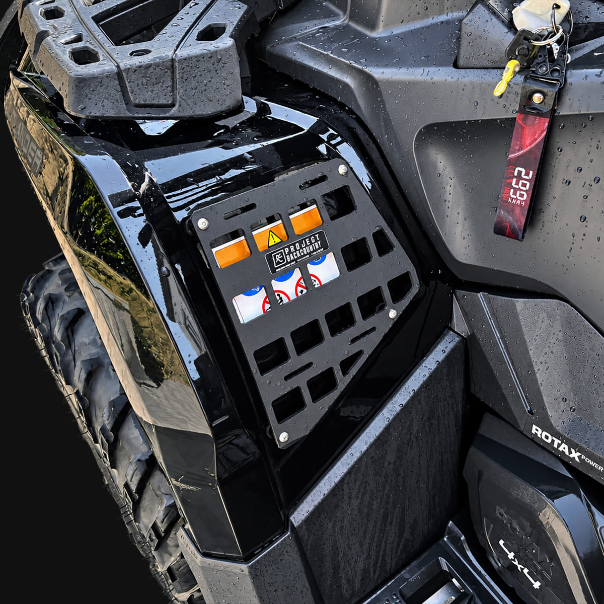 Project Backcountry Modular FenderLink MOLLE Panel installed on a black Can-Am Outlander 1000R Gen 2 left front fender.