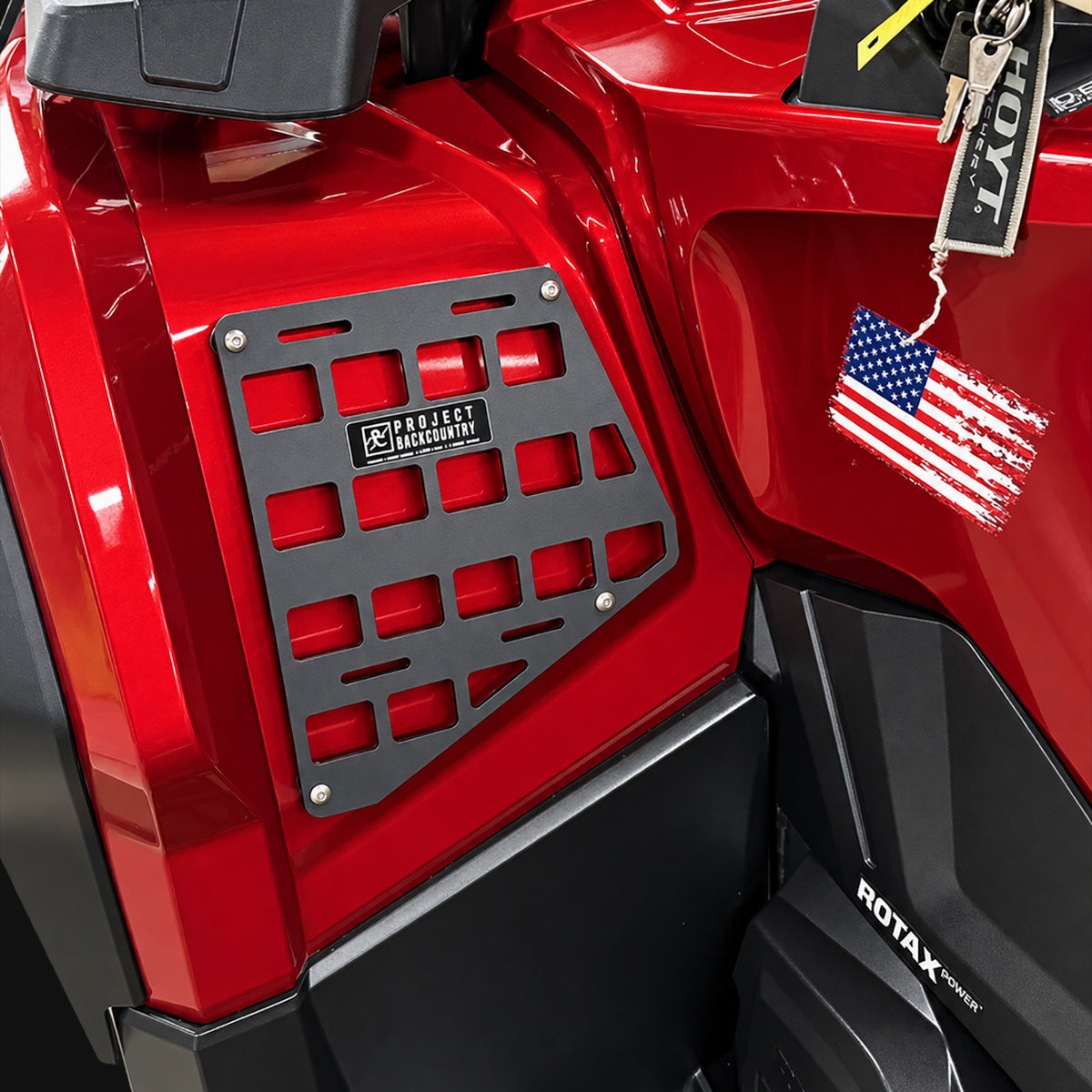 Project Backcountry Modular FenderLink MOLLE Panel installed on a red Can-Am Outlander 1000R Gen 2 left front fender.