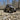 Lifted CFMOTO ZForce 950 Sport UTV with PERFEX suspension lift on rocky terrain.